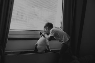 Man sitting by window at home