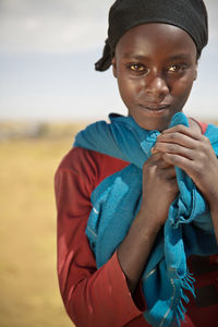 Portrait of boy holding camera