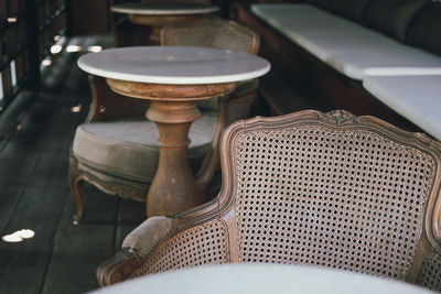 High angle view of empty chairs and table in cafe