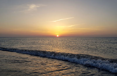 Scenic view of sea against sky during sunset