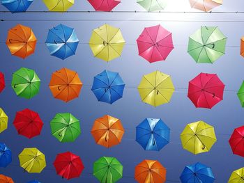 Low angle view of colorful umbrellas against sky