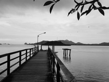 Pier over sea against sky