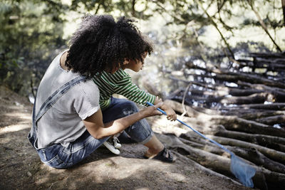 Mother with son playing with net