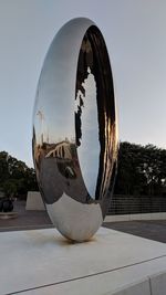 Close-up of ball on glass against clear sky