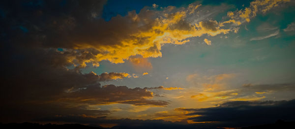 Low angle view of clouds in sky during sunset