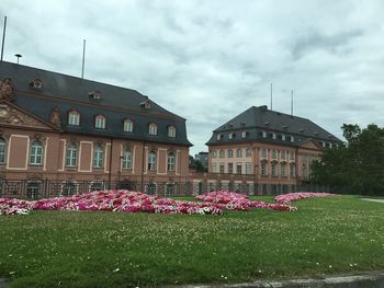 View of buildings against cloudy sky