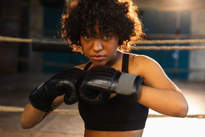 Young woman exercising in gym