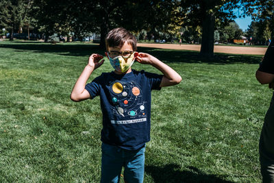 Full length of a boy standing in park