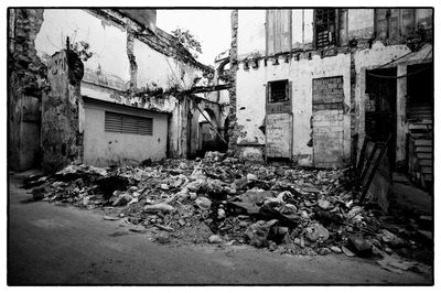 Abandoned house by plants