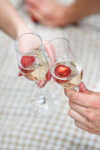 Close-up of hand holding wineglass