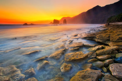 Scenic view of sea against sky during sunset