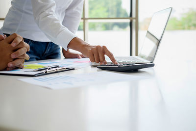 Business people budgeting on desk