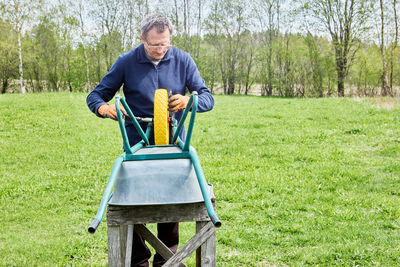 Portrait of man sitting on grass