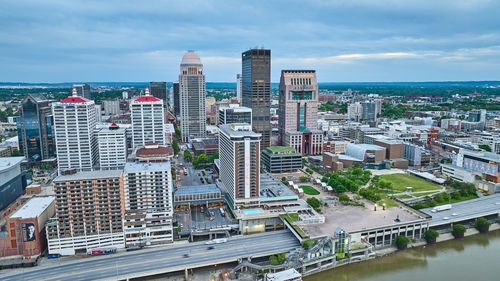 High angle view of buildings in city against sky