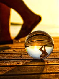 Close-up of crystal ball on wooden table