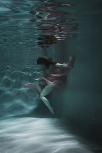 Woman swimming in pool