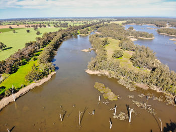 High angle view of lake and trees against sky