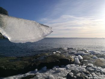 Scenic view of sea against sky during winter