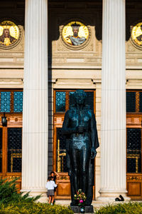 Low angle view of statue against building