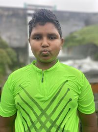 Portrait of young man standing outdoors