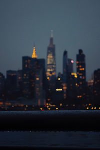 Illuminated buildings in city at night