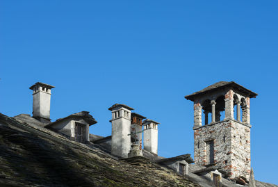 Low angle view of abandoned built structure against clear sky