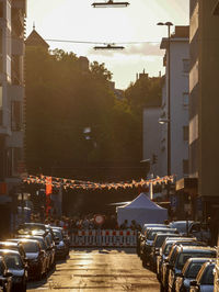 Cars on street amidst buildings in city