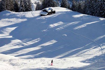 Person skiing on snow covered mountain