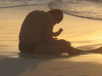 Silhouette of woman at sunset