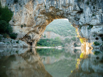 Reflection of rock formation in lake