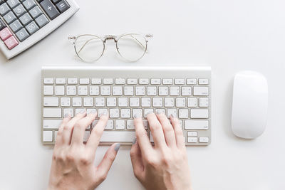 Directly above view of person using laptop on table