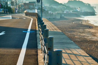 View of empty road in city by the beach in the morning