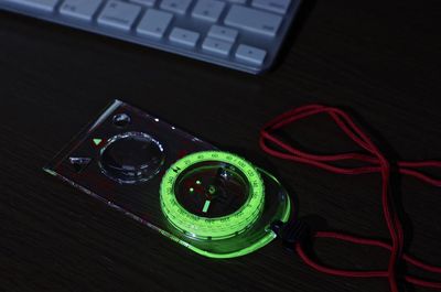 High angle view of navigation compass on table