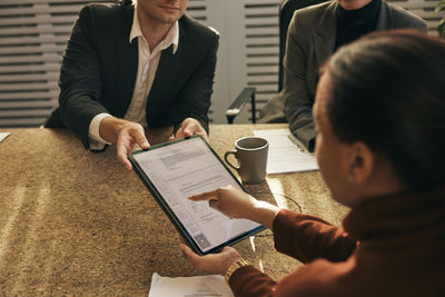 High angle view of woman using digital tablet