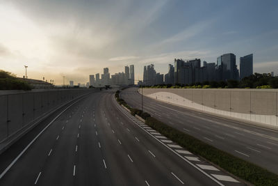 Highway in city against sky