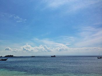 Boat sailing in sea against sky