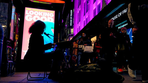 Group of people at music concert at night
