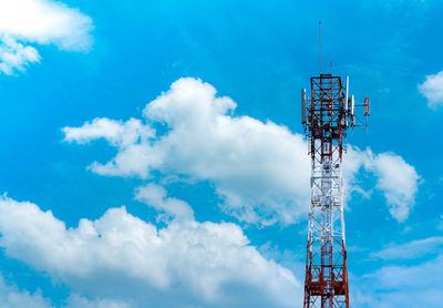 Low angle view of communications tower against blue sky. mobile or telecom 4g network.