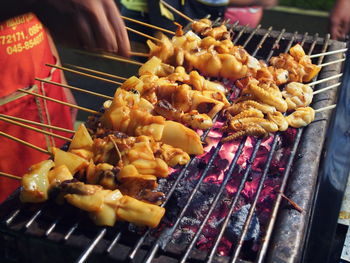 Close-up of meat on barbecue grill