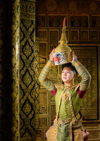 Khon, is a classic thai dance in a mask. this is hanuman dressed as the lord of the city.