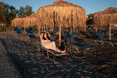 Empty chairs on beach