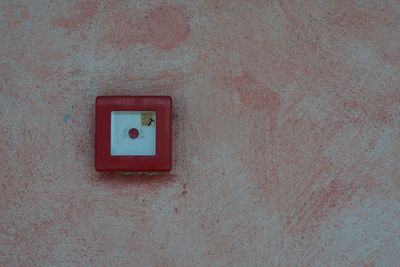 Close-up of push button on wall