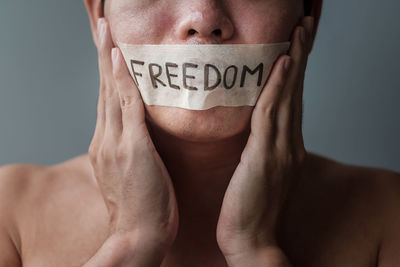 Close-up of human hand against white background