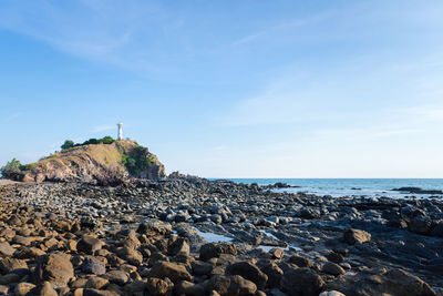 White lighthouse on a cliff at lanta noi island, south of thailand krabi province, landmark 
