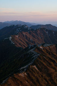 High angle view of mountains against sky during sunset