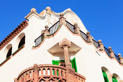 Low angle view of building against clear blue sky