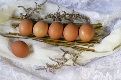 High angle view of eggs in container on bed