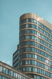 Low angle view of modern building against clear sky