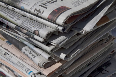 Close-up of stacked newspapers