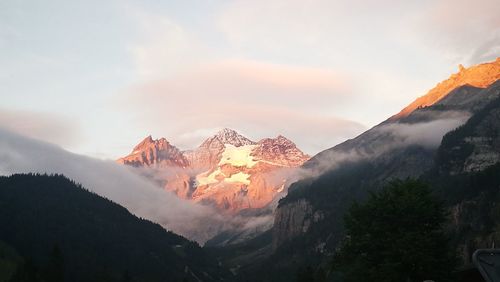 Scenic view of mountains against sky during sunset